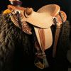 Wade tree, 15 inch seat, Gullet - 7 and 1/2 inch by 6 and 1/4 inch by 4 inch, Horn 4&1/2 inch round, 90 degree bars, 7/8ths full in-skirt riggin, Cheyenne Roll, Buckaroo outside leathers, half-breed Wade Saddle built and tooled with original floral and border design by Keith Valley.